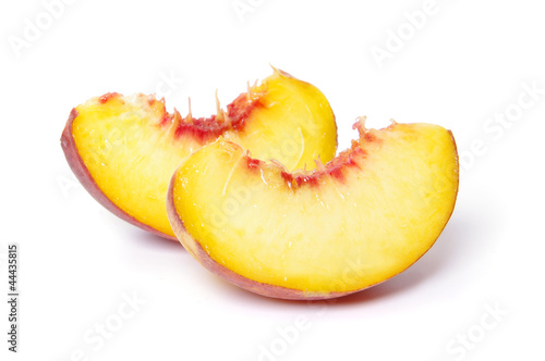 slices of peach on white background