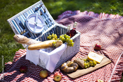 Picnic basket with fruit bread and wine