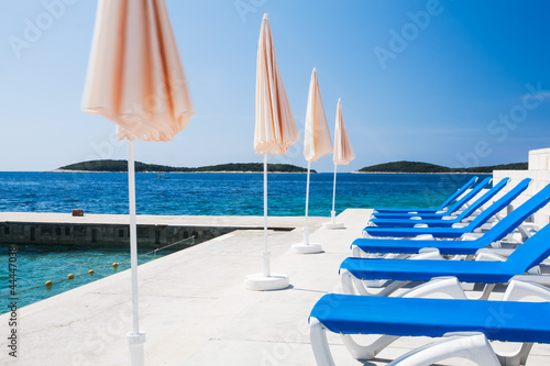 Umbrellas and sun chairs photo