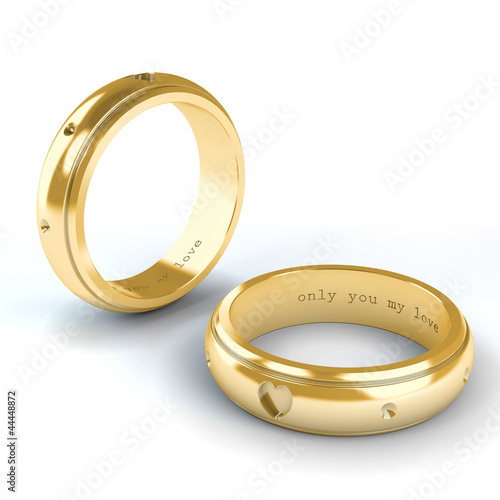 Wedding gold rings isolated on white background