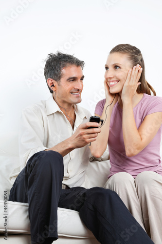 Couple Listening Music On Cell Phone