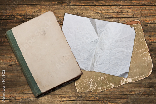 Weathered book and wrinkled paper