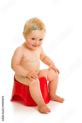 Toddler girl potty trainting isolated on white