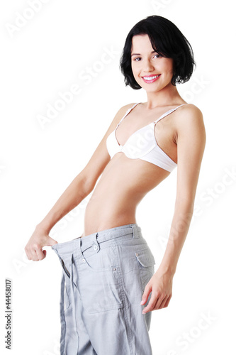 Young fit woman with big pants