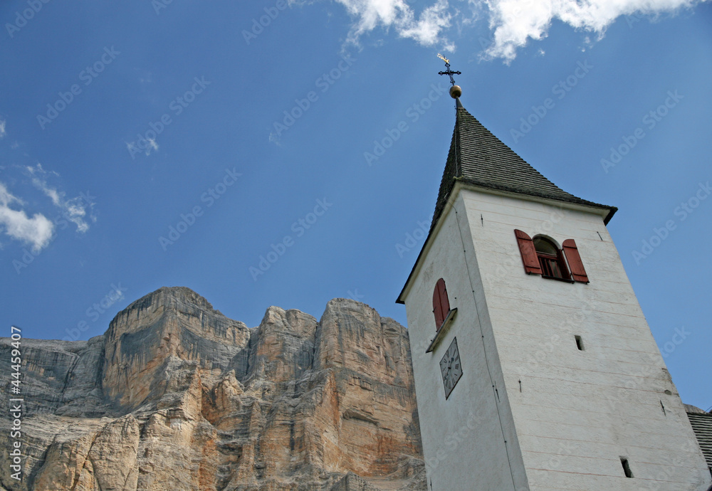 Bell tower on the foothills of the Dolomites