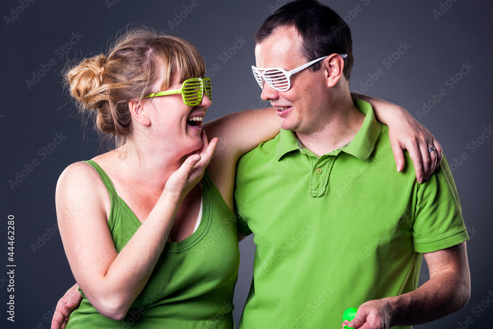 Fototapeta premium Happy young couple having fun - studio shot