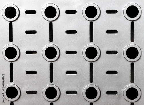 Fotografija Gray plastic background with holes.