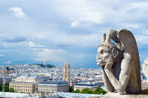 Gargoyle of Notre Dame looks to Paris