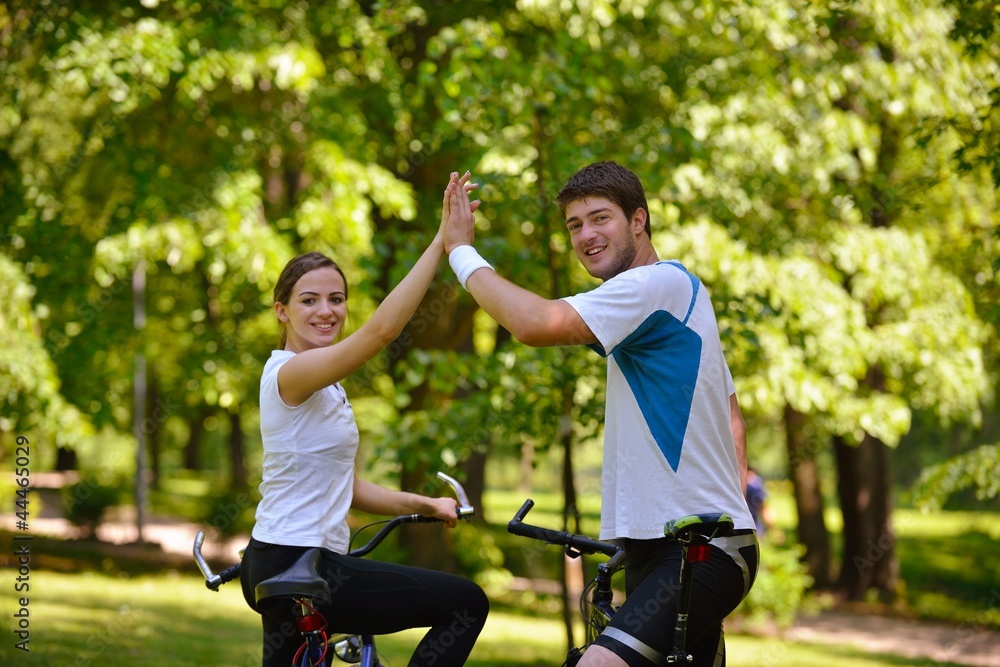 Fototapeta premium Happy couple ridine bicycle outdoors