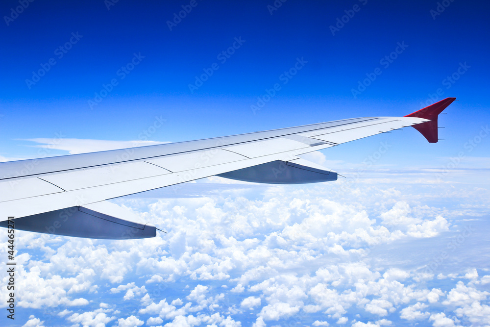 Airplane wings in the blue clouds. Airplane wings in the blue clouds.