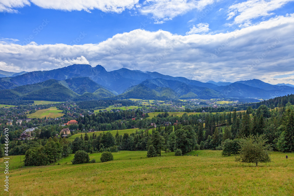 A view of The Tatra Mountains and village in summer, Poland.