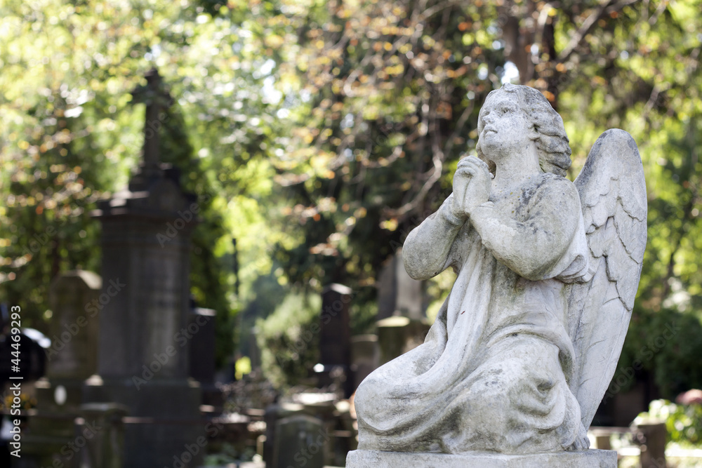 Statue of ancient angel on cemetery in Warsaw Statue of ancient angel on cemetery in Warsaw