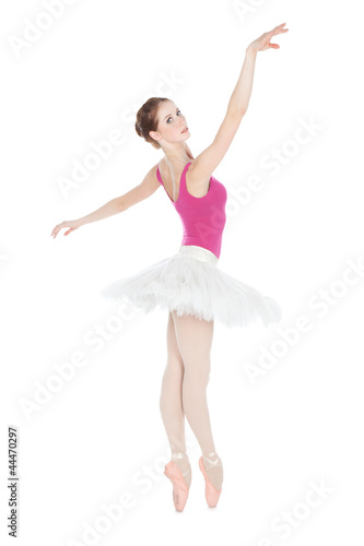 Young beautiful dancer posing on a studio