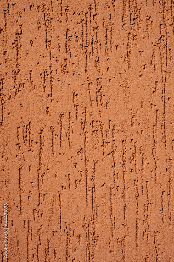 red striated stucco wall texture
