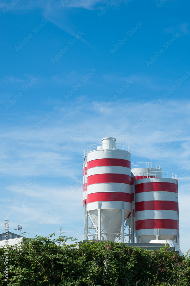 white storage tanks with red stripes white storage tanks with red stripes