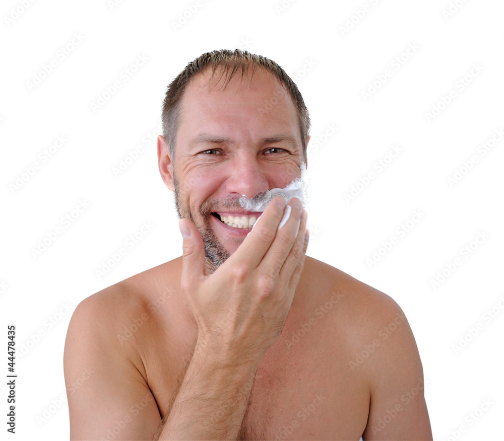Smiling man shaving with foam on the white background Smiling man shaving with foam on the white background