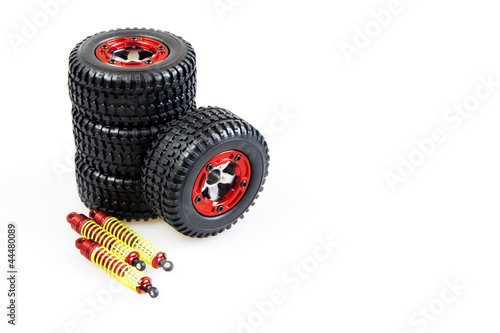 shock-absorbers and wheels of rc car on a white background