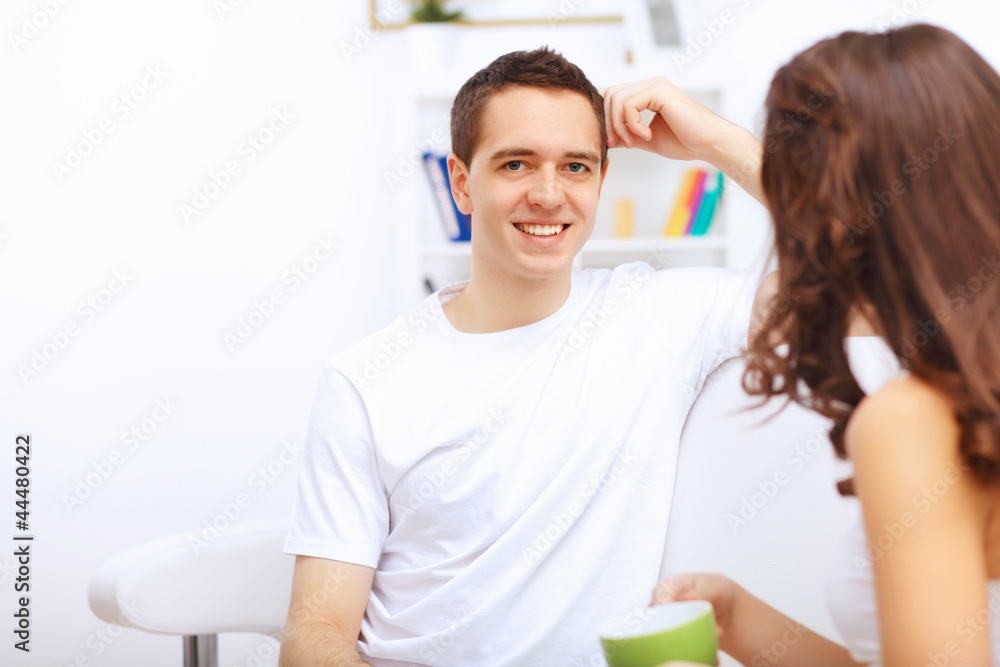 Fototapeta premium Young happy couple at hone together s