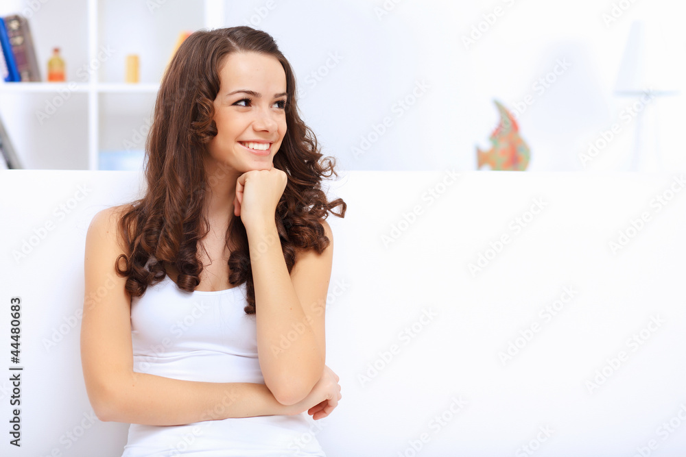 Young pretty woman in white at home Young pretty woman in white at home