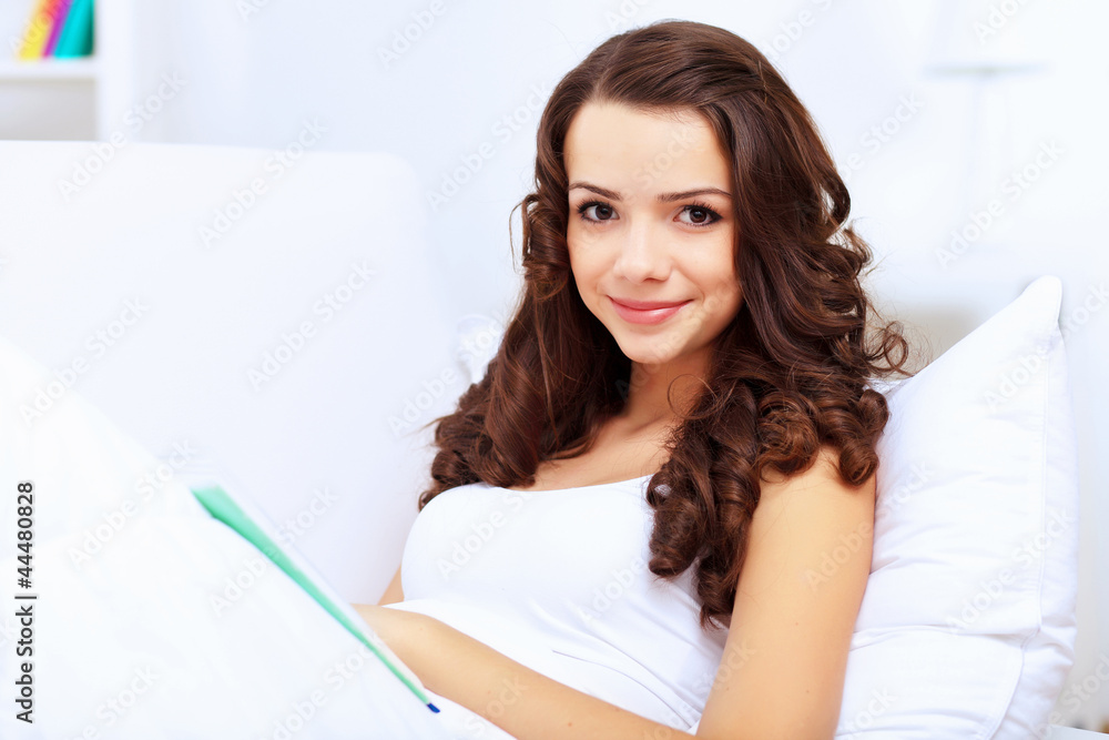 Young woman at home with a book Young woman at home with a book