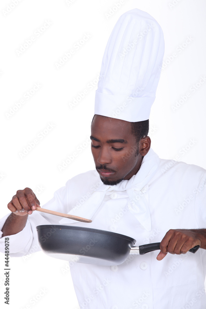 Chef checking sauce Chef checking sauce