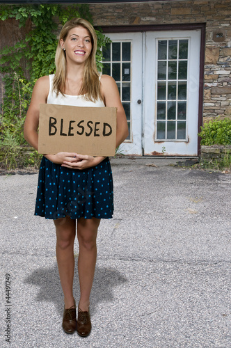 Woman Holding Sign that says Blessed photo