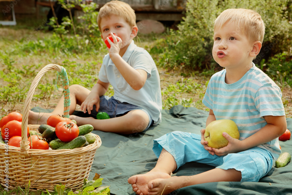 Fototapeta premium Kids with vegetables and fruits