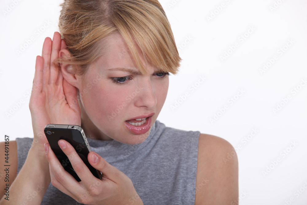 A nice looking woman having troubles hearing. A nice looking woman having troubles hearing.