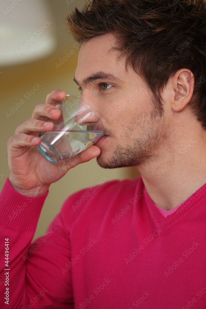 Man drinking glass of water Man drinking glass of water