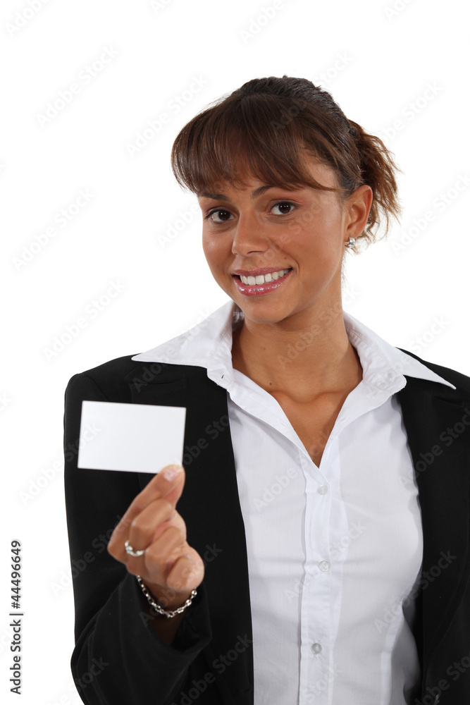 Brunette brandishing business card Brunette brandishing business card