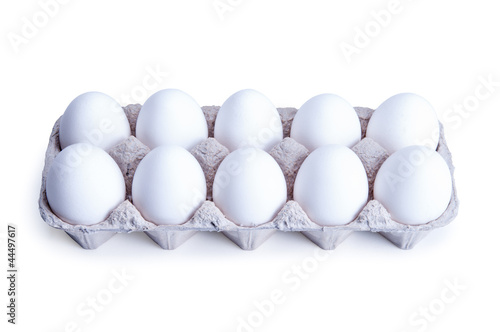 Ten white eggs in a box