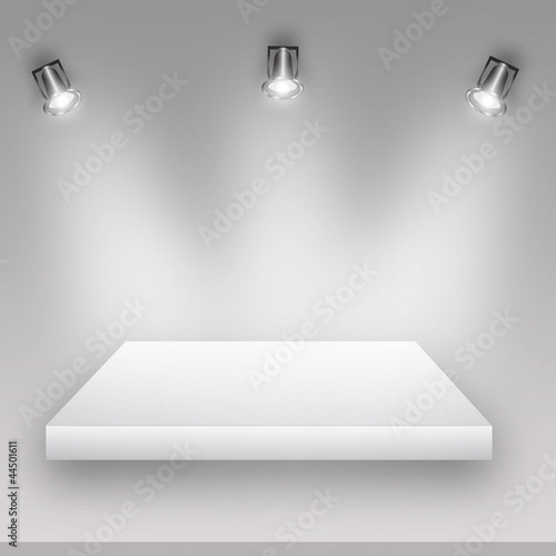 Empty shelf for exhibit with white wall