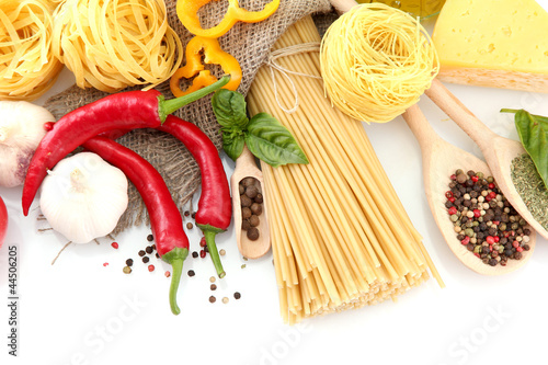 Pasta spaghetti  vegetables and spices  isolated on white