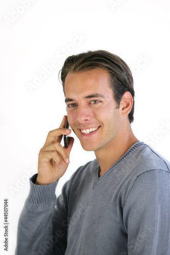Smiling man talking on his mobile phone