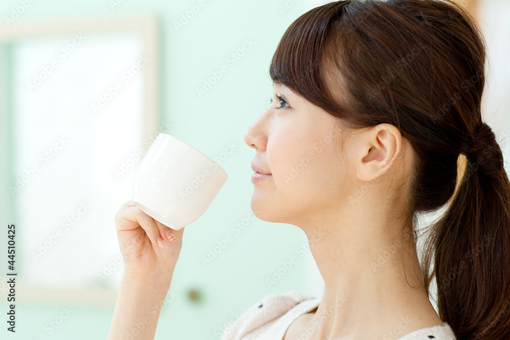Beautiful young woman drinking coffee. Portrait of asian. Beautiful young woman drinking coffee. Portrait of asian.