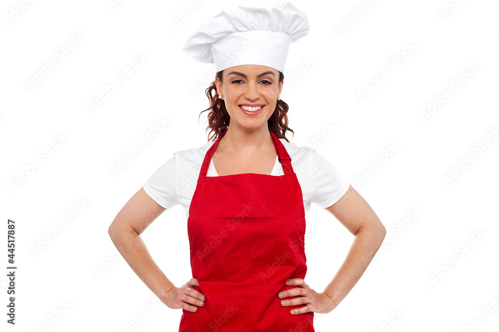 Cure female chef posing with hands on her waist Cure female chef posing with hands on her waist