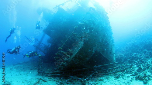 Ship wreck Carnatic and divers. Red Sea. photo
