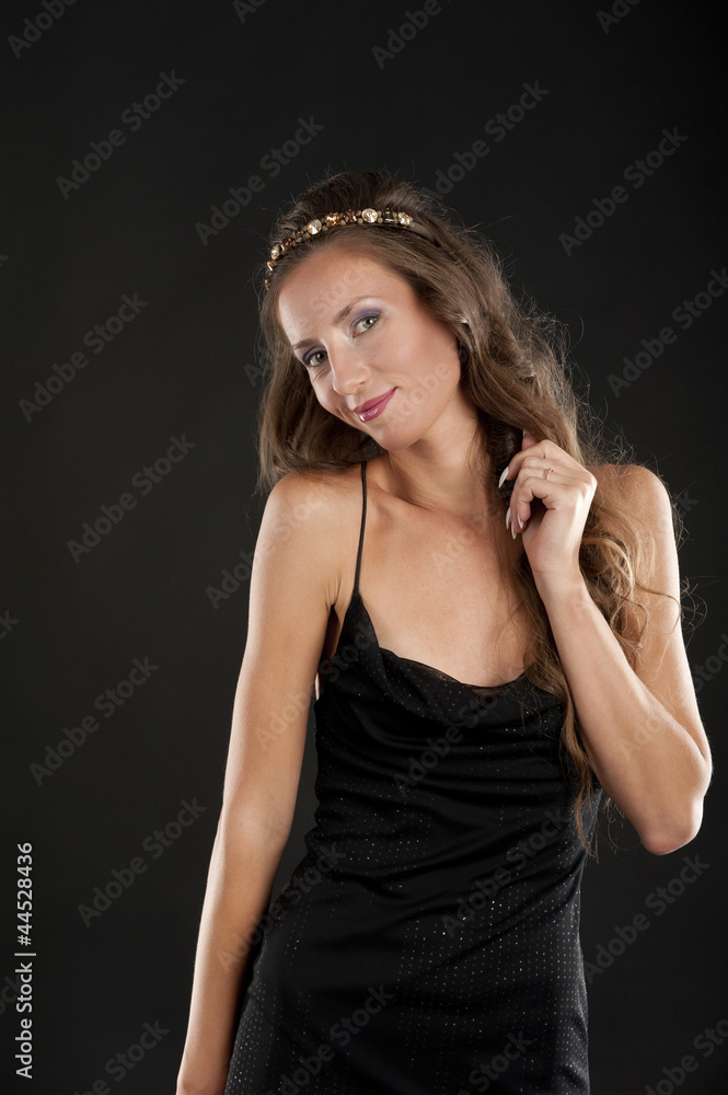 Fototapeta premium A young woman in a black dress
