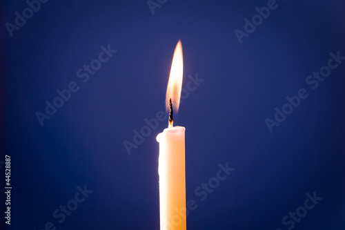 Lit Candle with blue background