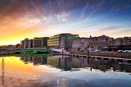 Amazing sunset at the river of Cork city in Ireland photo