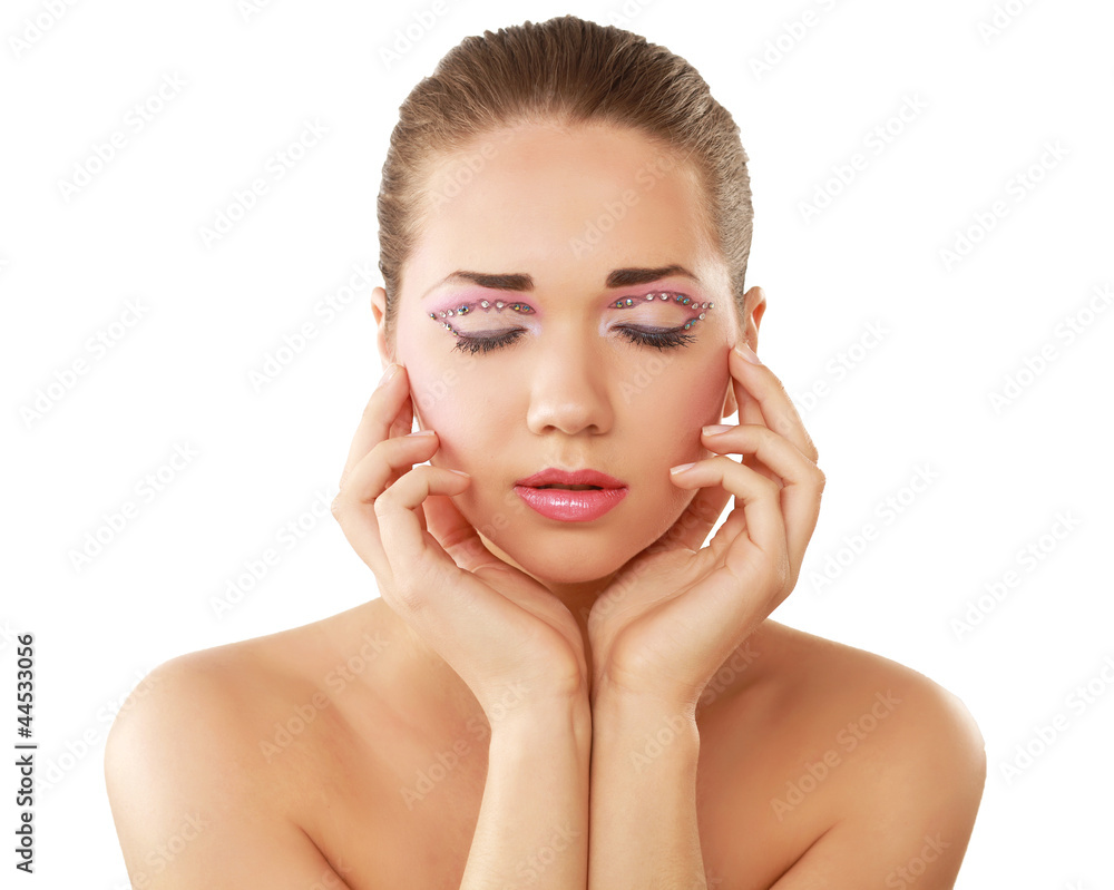 Woman eye with exotic style makeup, touching her face Woman eye with exotic style makeup, touching her face