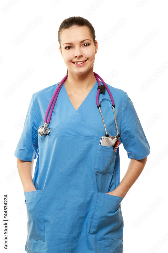 Young nurse standing with her hands in pockets Young nurse standing with her hands in pockets