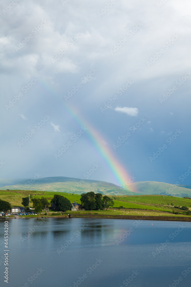 rainbow over a lake rainbow over a lake