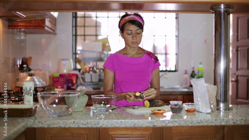 young mother preparing food at kitchen young mother preparing food at kitchen