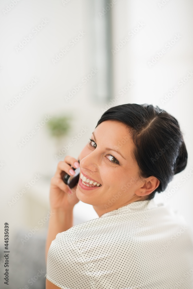Portrait of happy young woman speaking mobile phone Portrait of happy young woman speaking mobile phone