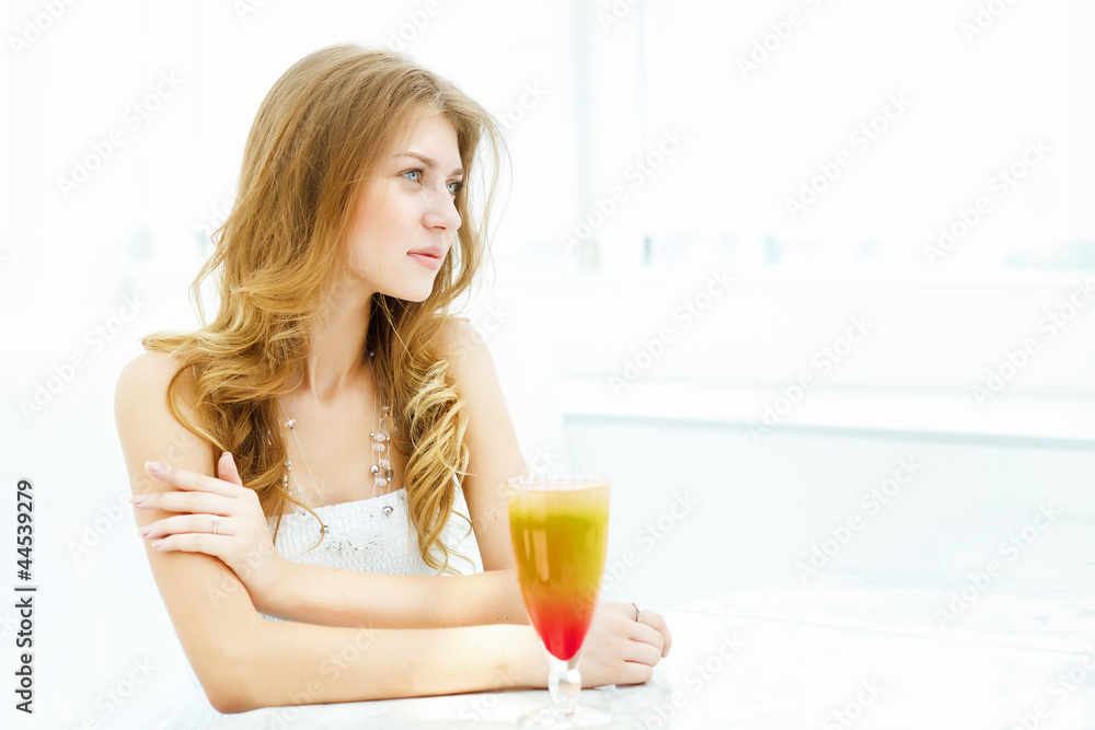 Young woman with a glass of drink Young woman with a glass of drink