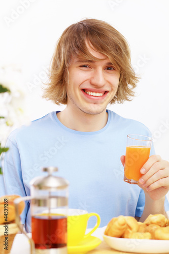 Young man drinking juice
