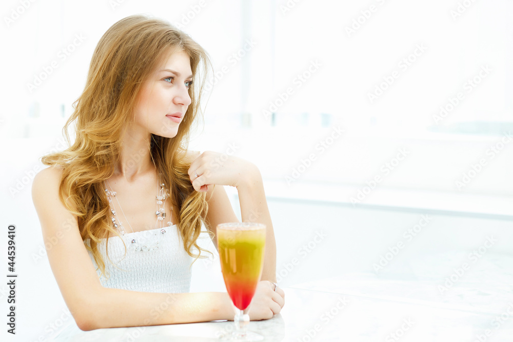 Young woman with a glass of drink Young woman with a glass of drink