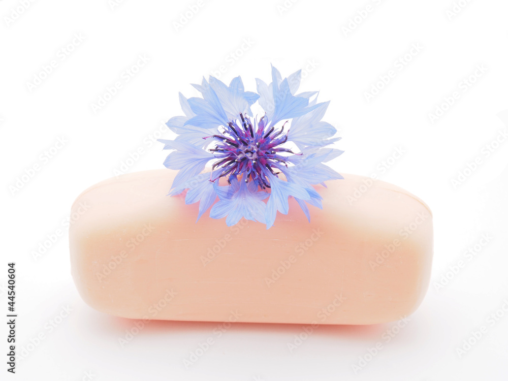 cornflowers and soap on a white background