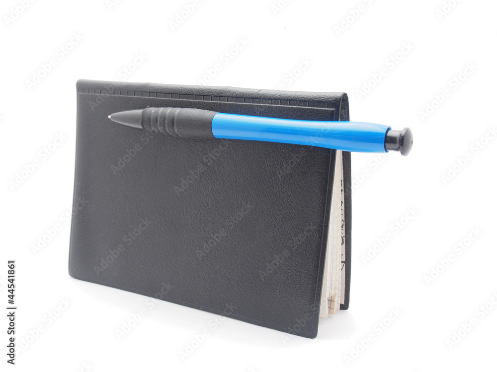 pen and notebook on a white background pen and notebook on a white background